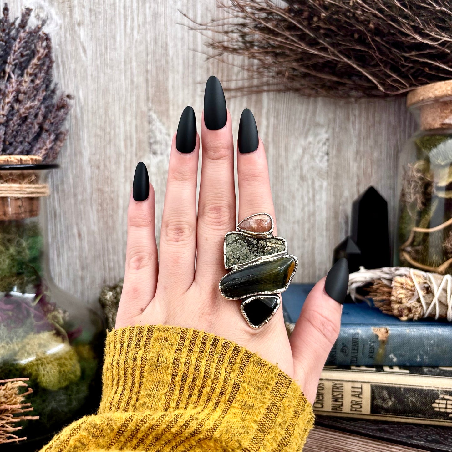 Silver size 8 FOXLARK ring featuring multi-stone obsidian, marcasite, blue tiger's eye, and sun stone with intricate design.