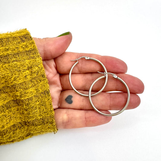 FoXLARK Everyday Charm Collector Hoop Earrings with round tube stainless steel charms, stylish earring hoops from Lucky Charm Bar