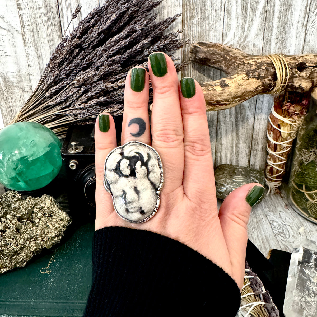 Fine silver ceramic baby doll head ring by FOXLARK, size 7.5, from the Foxlark Collection, showcasing intricate craftsmanship.