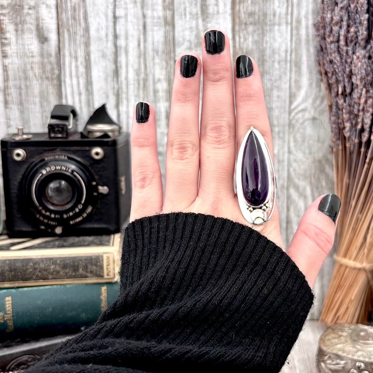 Sterling silver purple amethyst ring with gothic moon design, adjustable statement jewelry by FOXLARK, featuring a large witchy crystal.