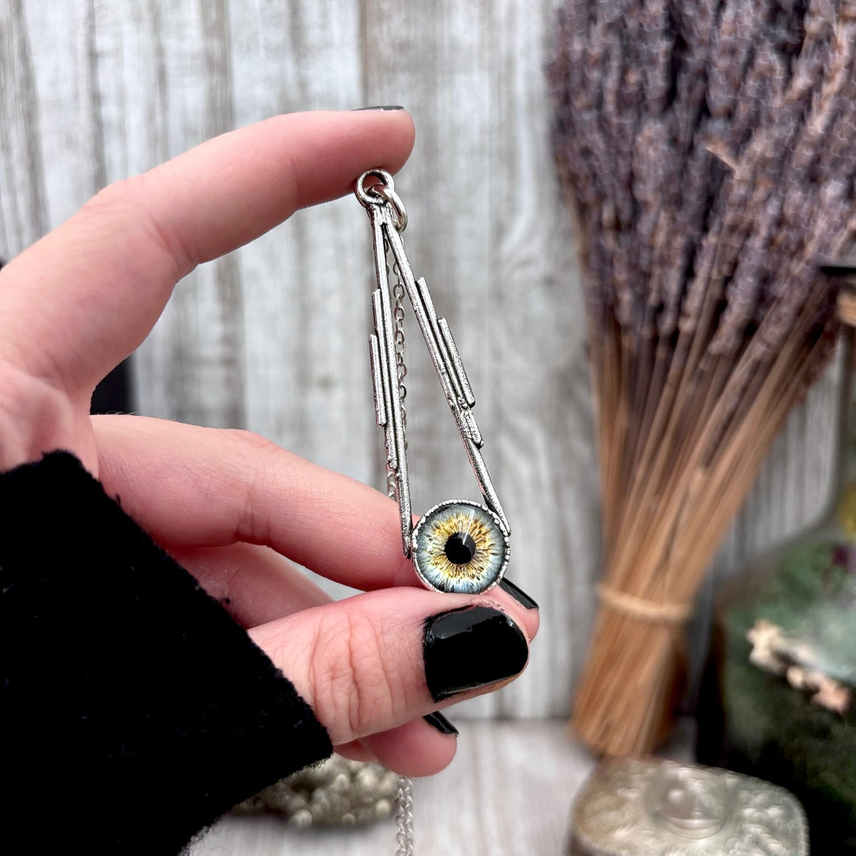 Blue eyeball pendant necklace in fine silver from FOXLARK collection, featuring a unique, detailed eyeball design.