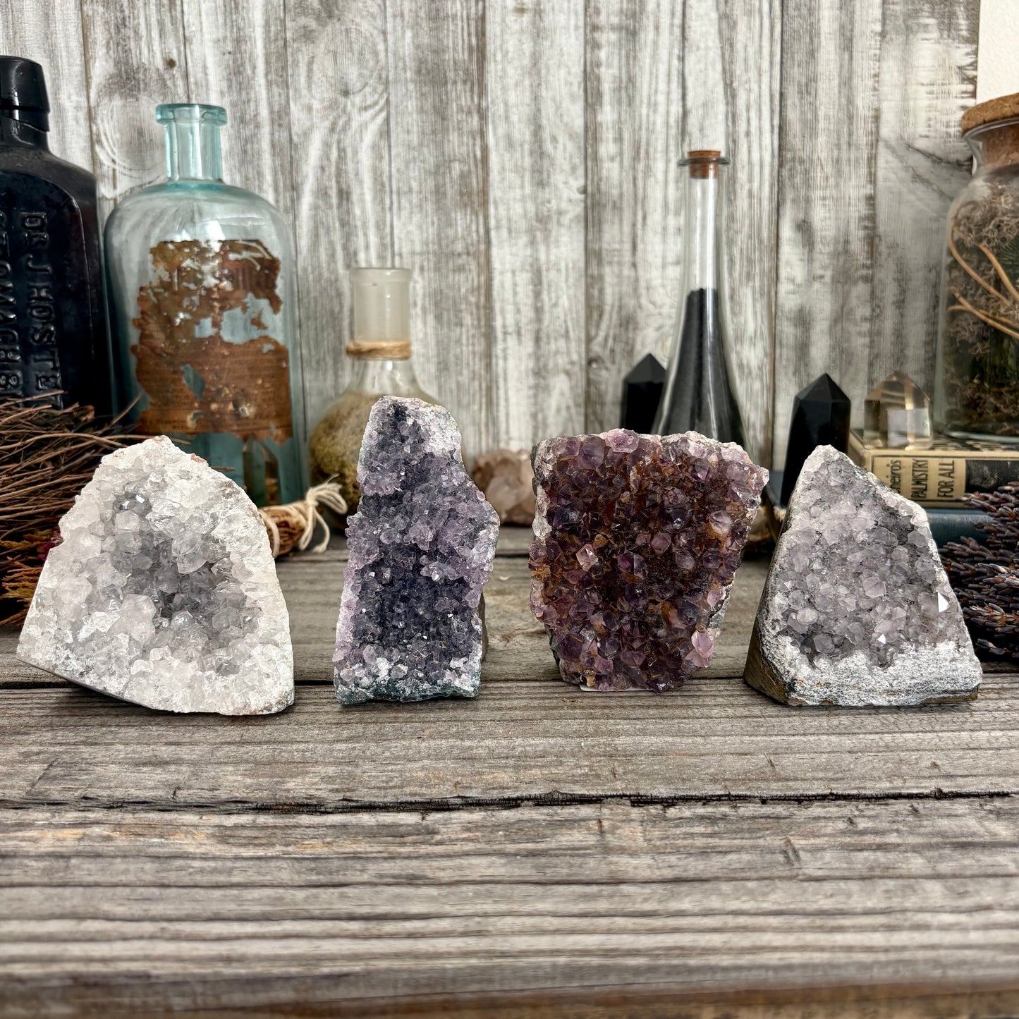 Self-standing amethyst geode crystal cluster from FoxlarkCrystals, featuring purple crystal points and natural rock base.