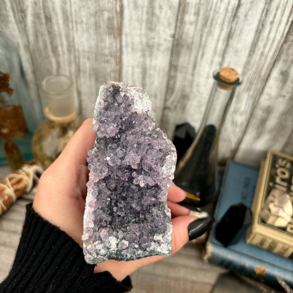Self-standing amethyst geode crystal cluster from FOXLARK, showcasing purple crystalline formations and natural rock base.