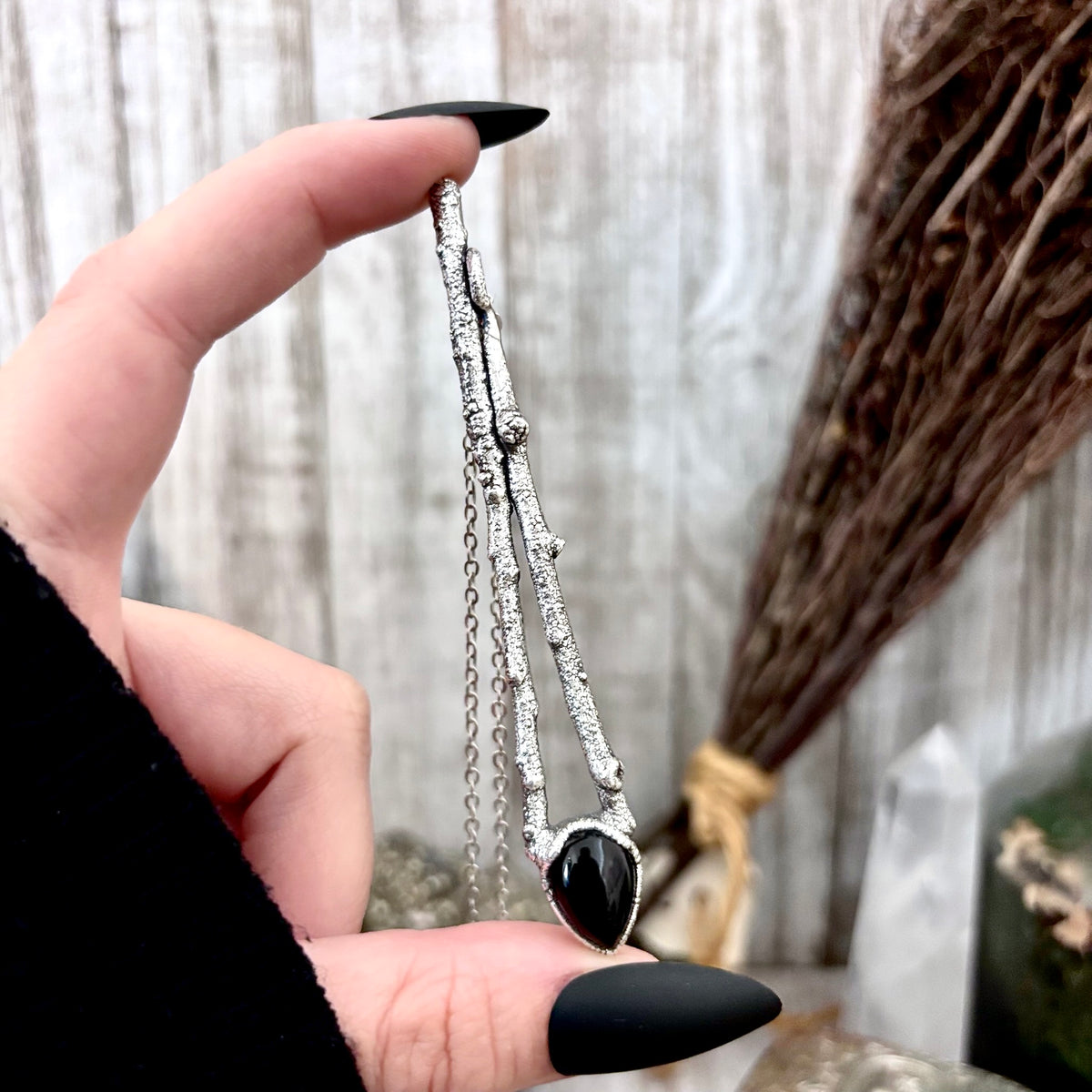 Black Onyx crystal necklace in silver from FOXLARK's Sticks & Stones Collection, featuring a sleek, polished design with a black onyx pendant.