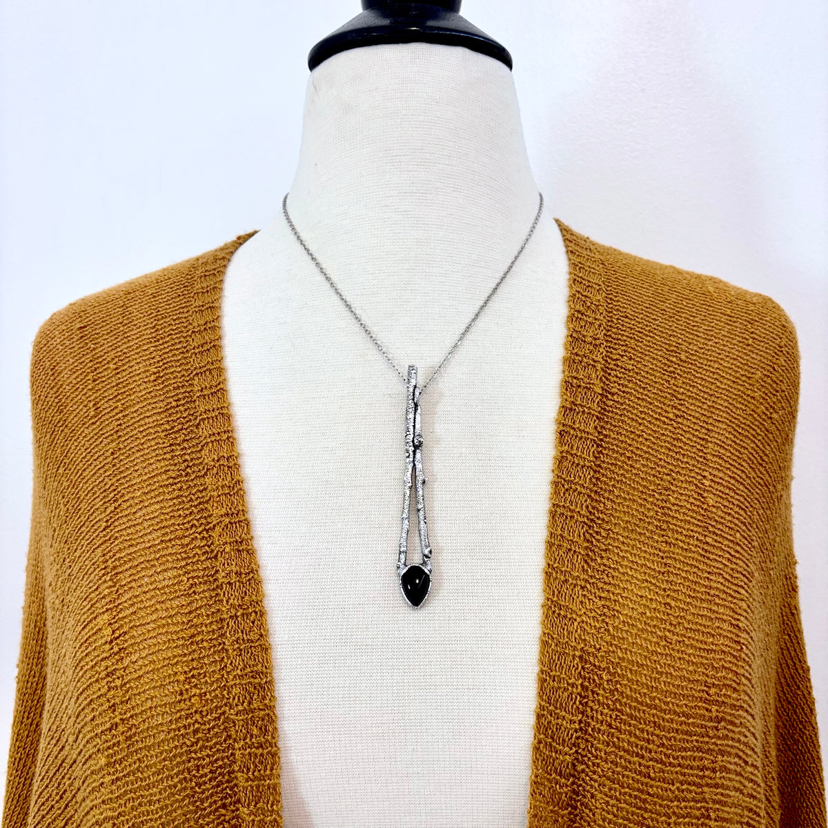 Black Onyx crystal necklace with silver sticks, from FOXLARK's NECKLACES collection, showcasing a sleek, elegant jewelry piece.