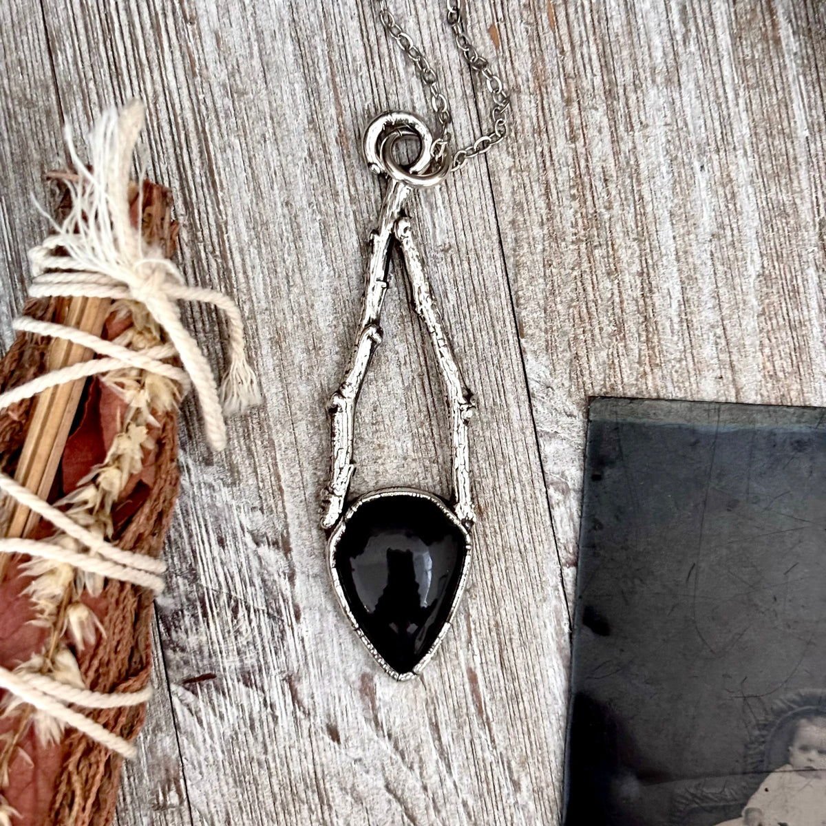 Black Onyx crystal necklace with silver sticks from FOXLARK's NECKLACES collection, featuring a sleek and elegant design.