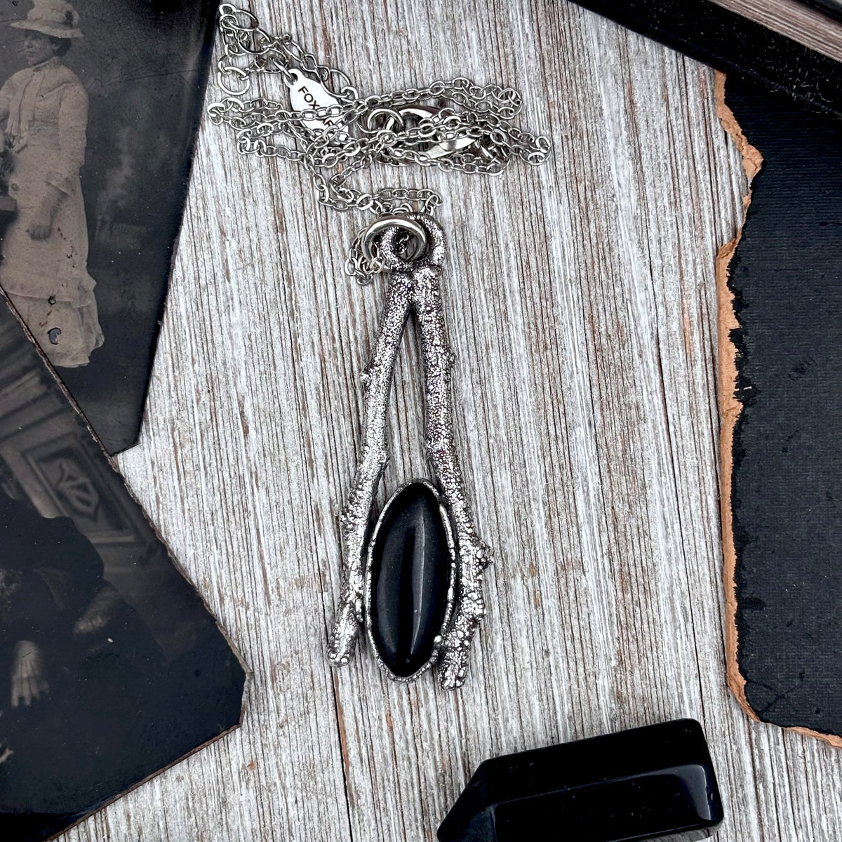 Black onyx crystal necklace with silver sticks, from FOXLARK's Sticks & Stones collection, featuring a sleek and elegant design.