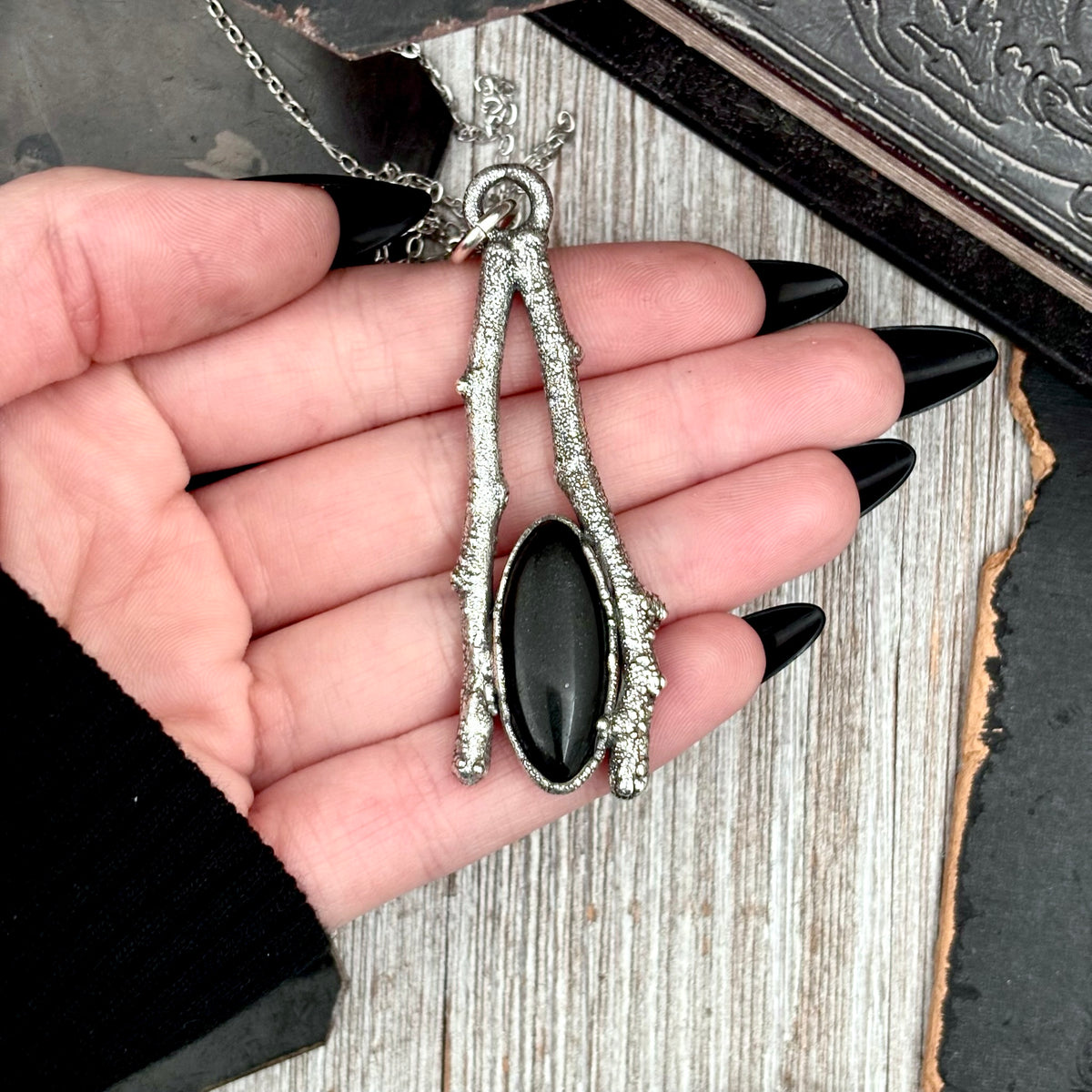 Black Onyx crystal necklace in silver from FOXLARK's Sticks & Stones collection, featuring a sleek black gemstone pendant.
