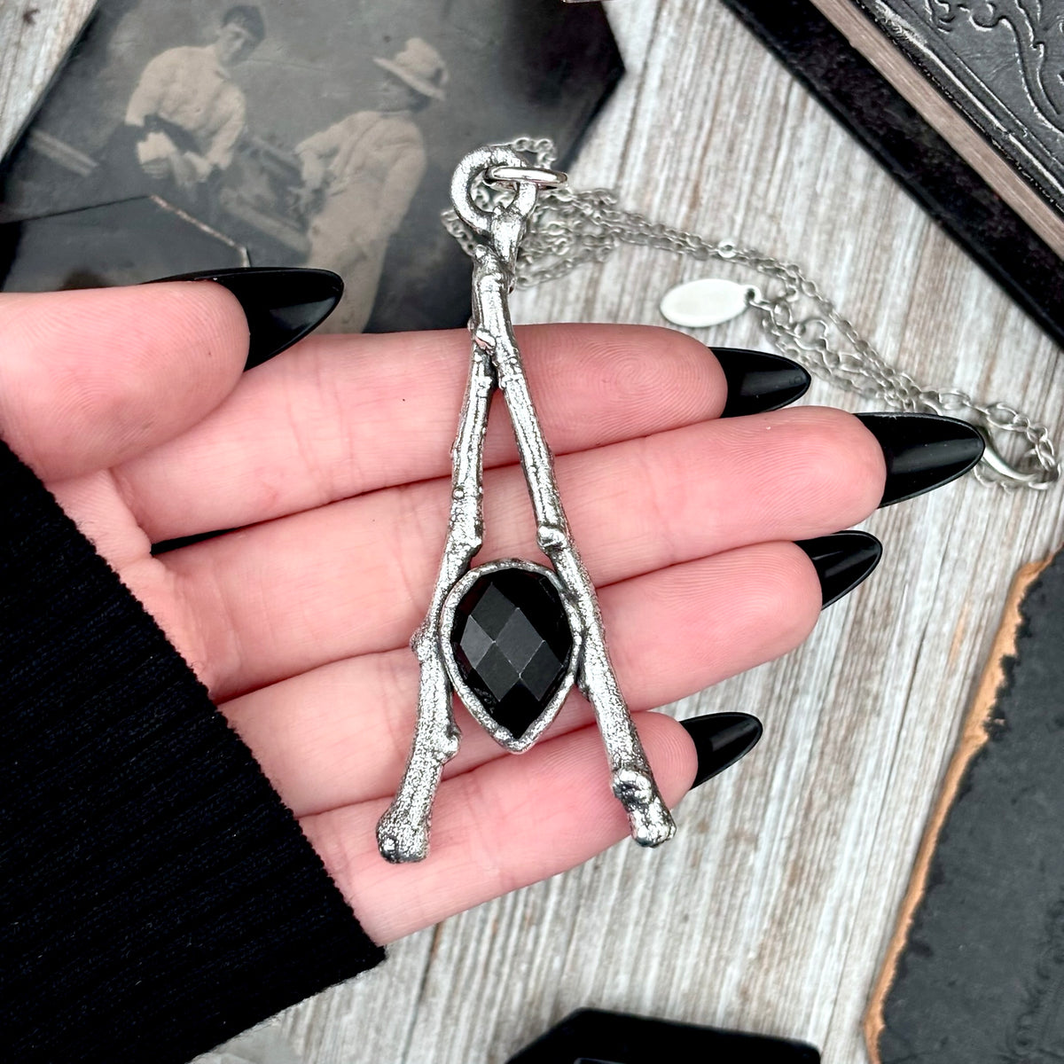 Black Onyx crystal necklace in silver from FOXLARK's Sticks & Stones Collection, featuring a sleek, polished pendant design.