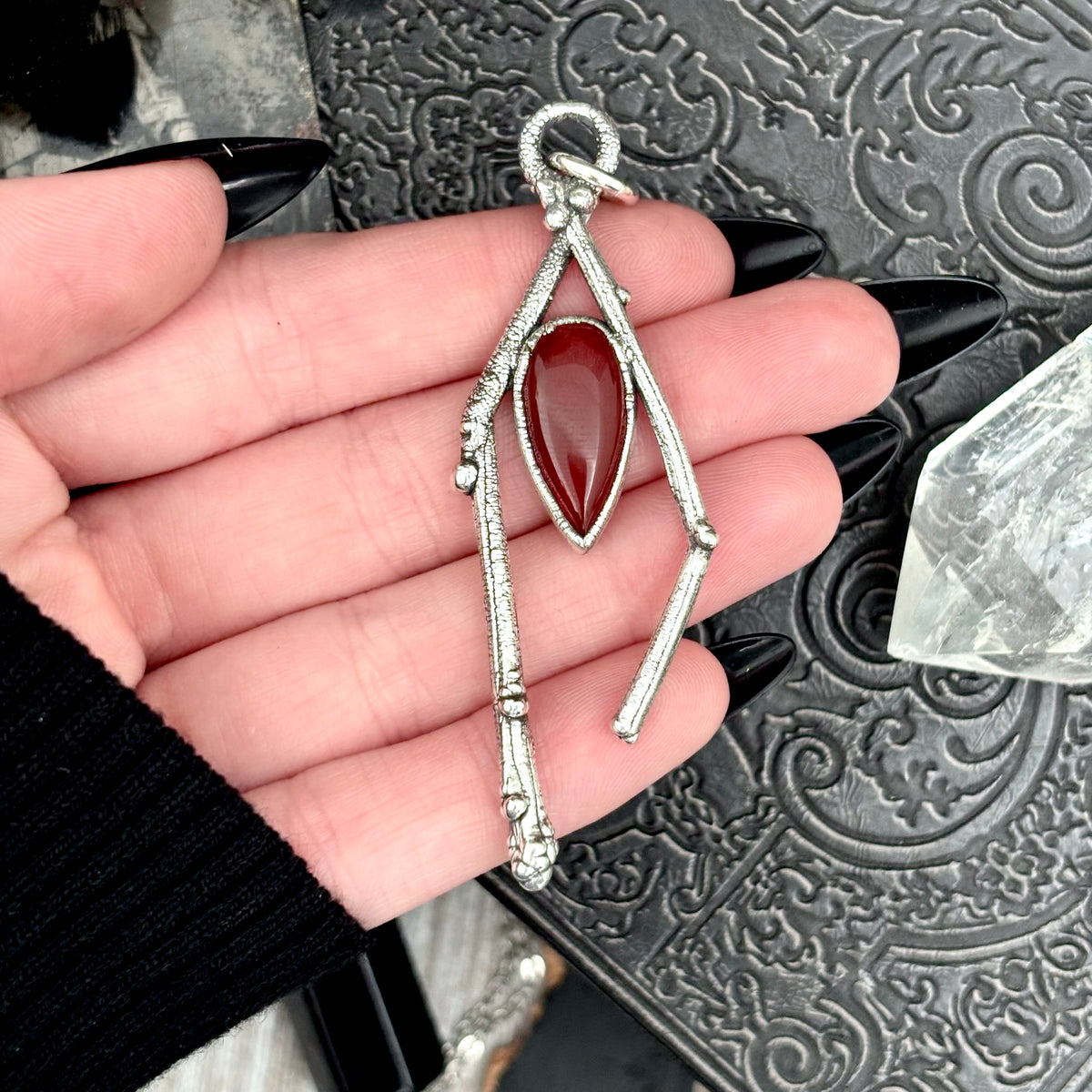 Carnelian crystal necklace with silver sticks from FOXLARK's Sticks & Stones Collection, featuring a vibrant orange-red gemstone pendant.