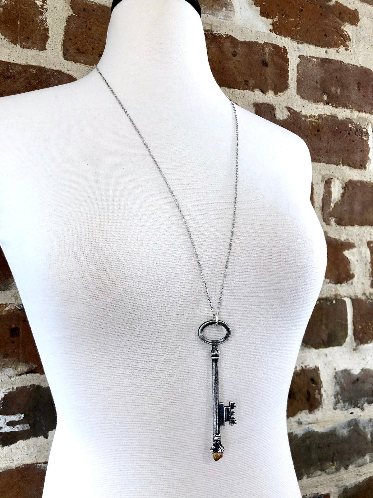 Vintage skeleton key necklace with raw citrine gemstone in fine silver, from FOXLARK's one-of-a-kind skeleton key jewelry collection.