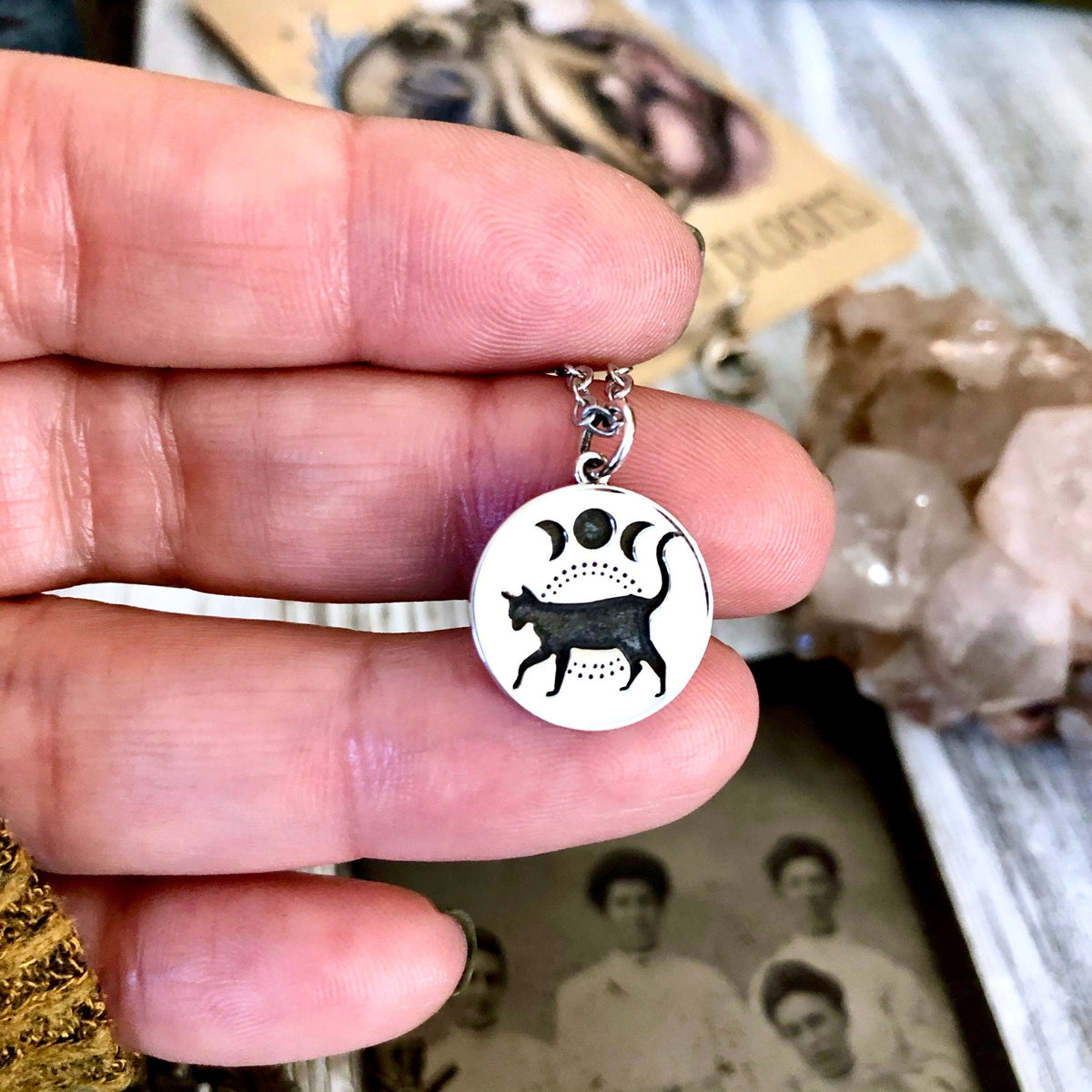 Sterling silver black cat and moon phase pendant from FOXLARK Tiny Talisman Collection, 15mm necklace charm.