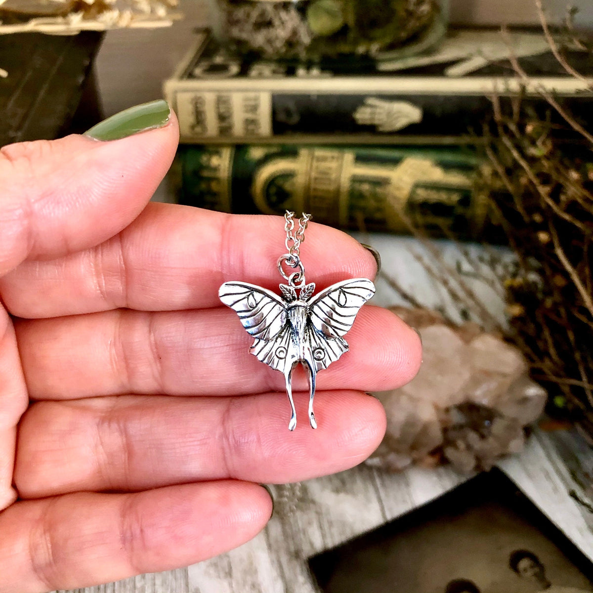 Sterling silver Luna moth pendant from FOXLARK Tiny Talisman Collection, 23x24mm, featuring detailed moth design.