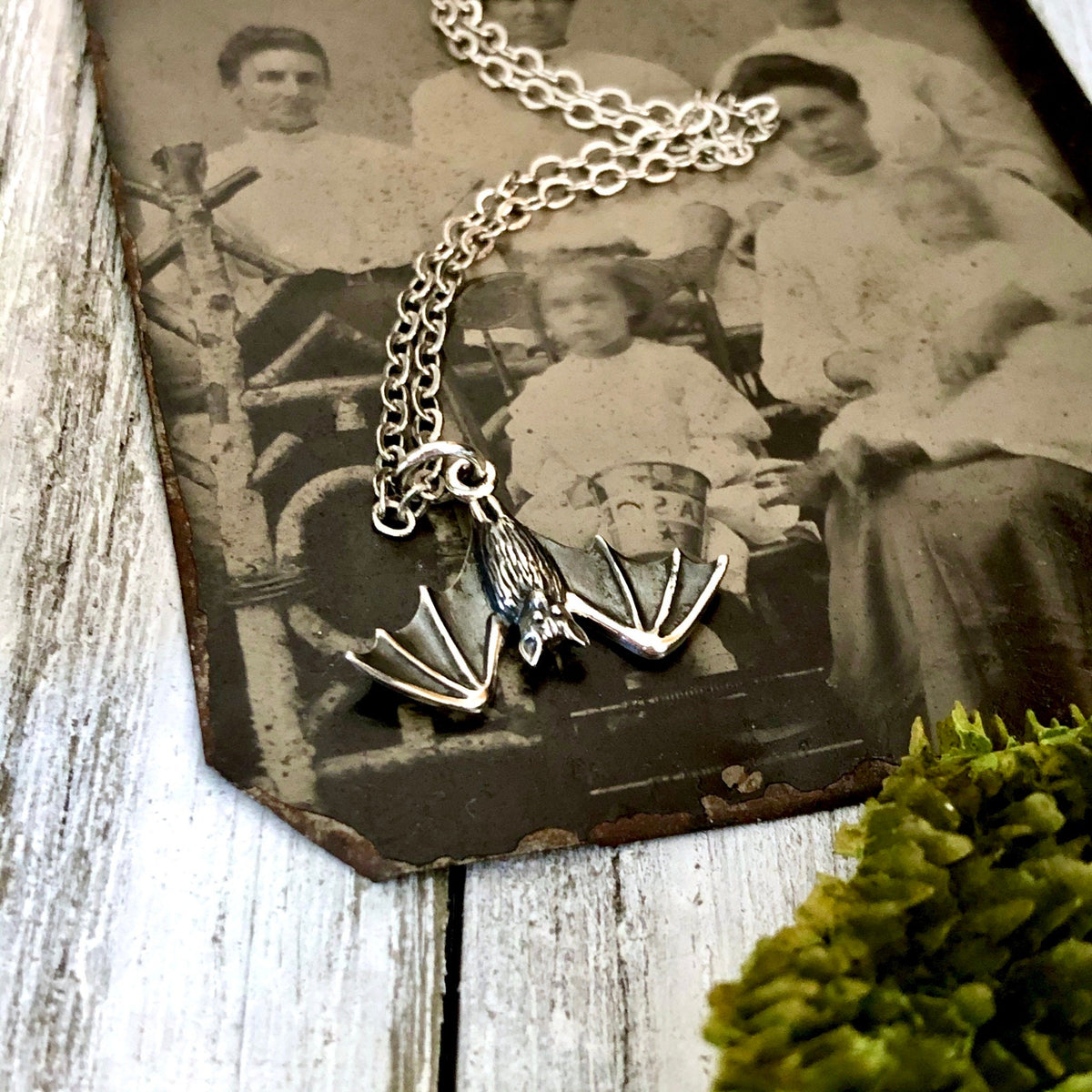 Sterling silver Tiny Bat Necklace Pendant from FOXLARK Tiny Talisman Collection, 12x20mm, featuring a detailed bat charm.