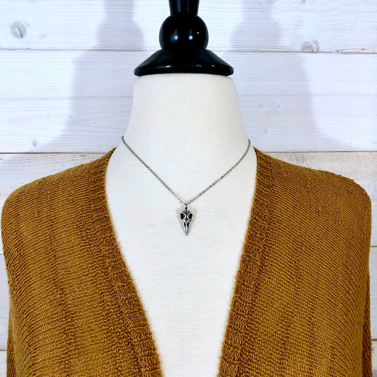 Sterling silver raven skull pendant from FOXLARK Tiny Talisman Collection, 22x10mm, featuring detailed craftsmanship.