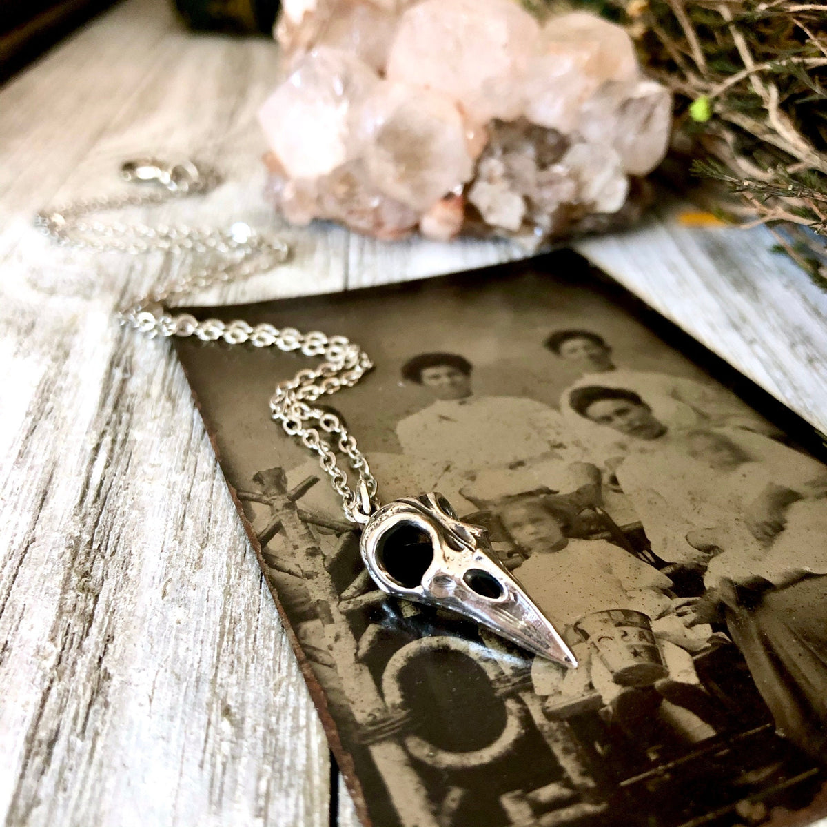 Sterling silver Raven Skull necklace pendant from FOXLARK Tiny Talisman Collection, 22x10mm, detailed and handcrafted jewelry piece.