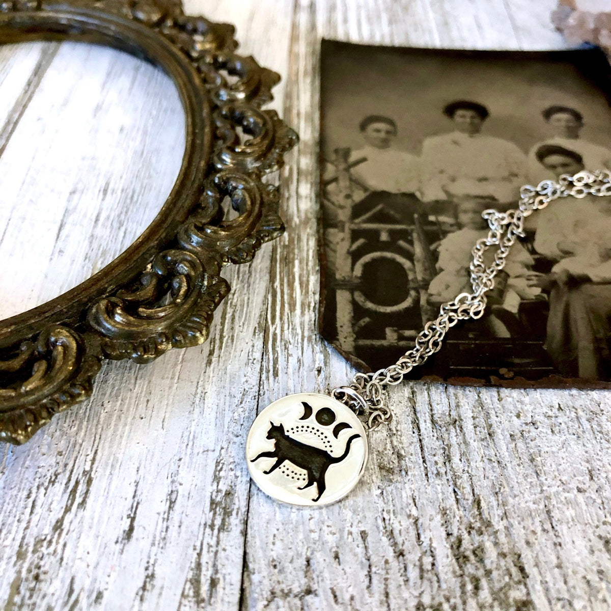 Sterling silver black cat and moon phase necklace pendant from FOXLARK's Tiny Talisman Collection, 15mm size.
