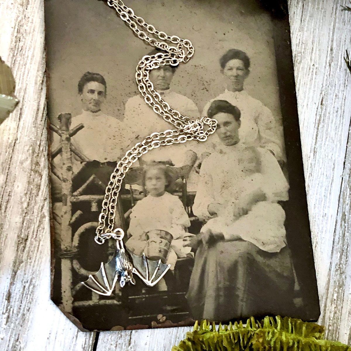 Sterling silver Tiny Bat Talisman necklace pendant from FOXLARK, measuring 12x20mm, featuring a detailed bat design.