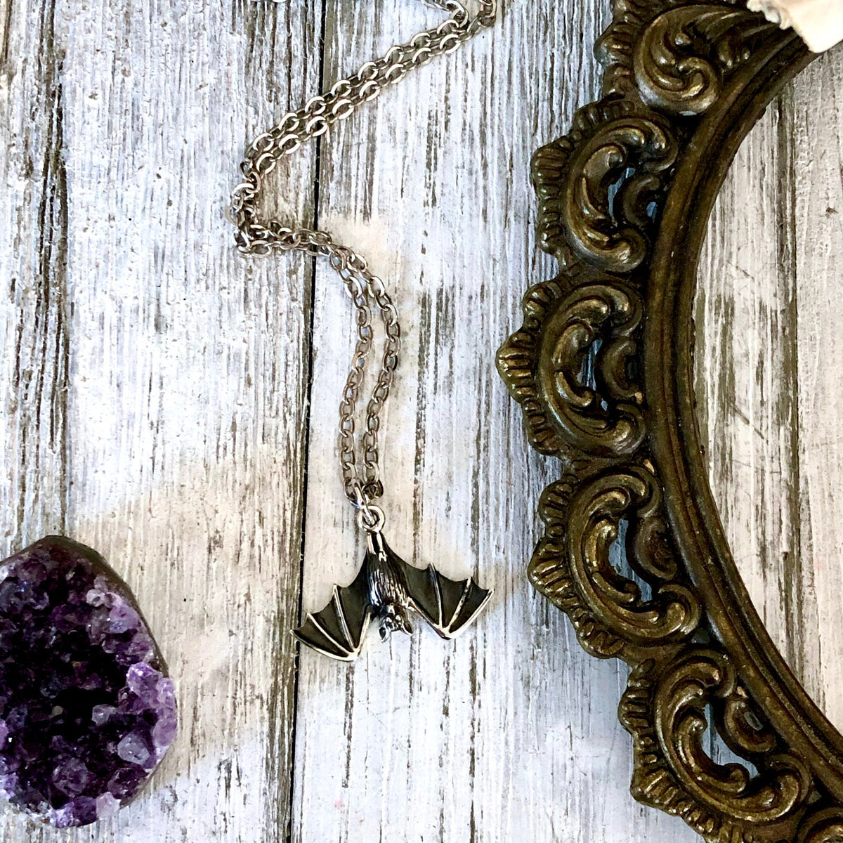 Sterling silver tiny bat pendant from FOXLARK's Tiny Talisman Collection, 12x20mm, featuring detailed bat design.