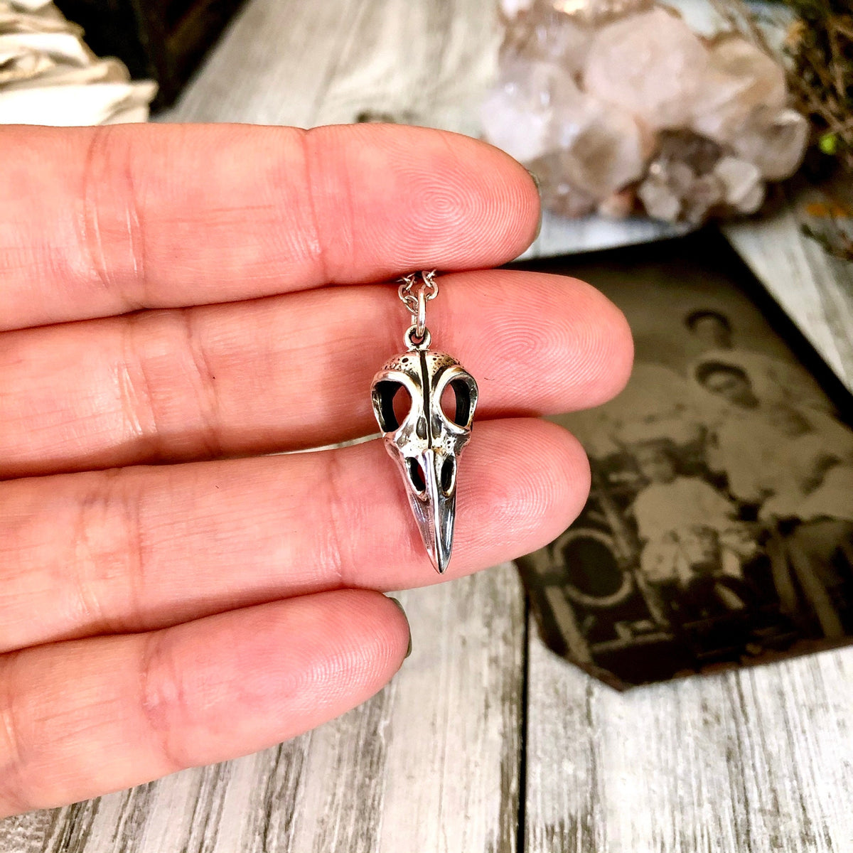 Sterling silver Raven skull pendant from FOXLARK Tiny Talisman Collection, 22x10mm, featuring detailed craftsmanship.