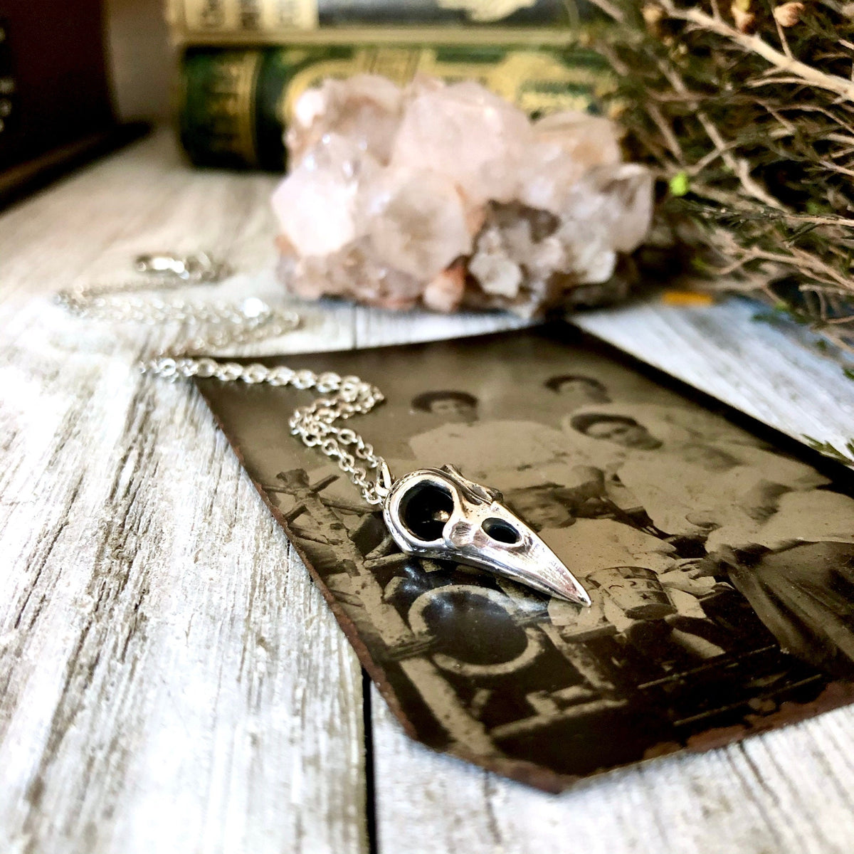Sterling silver Raven Skull pendant from FOXLARK Tiny Talisman Collection, 22x10mm, featuring detailed skull design for necklace.