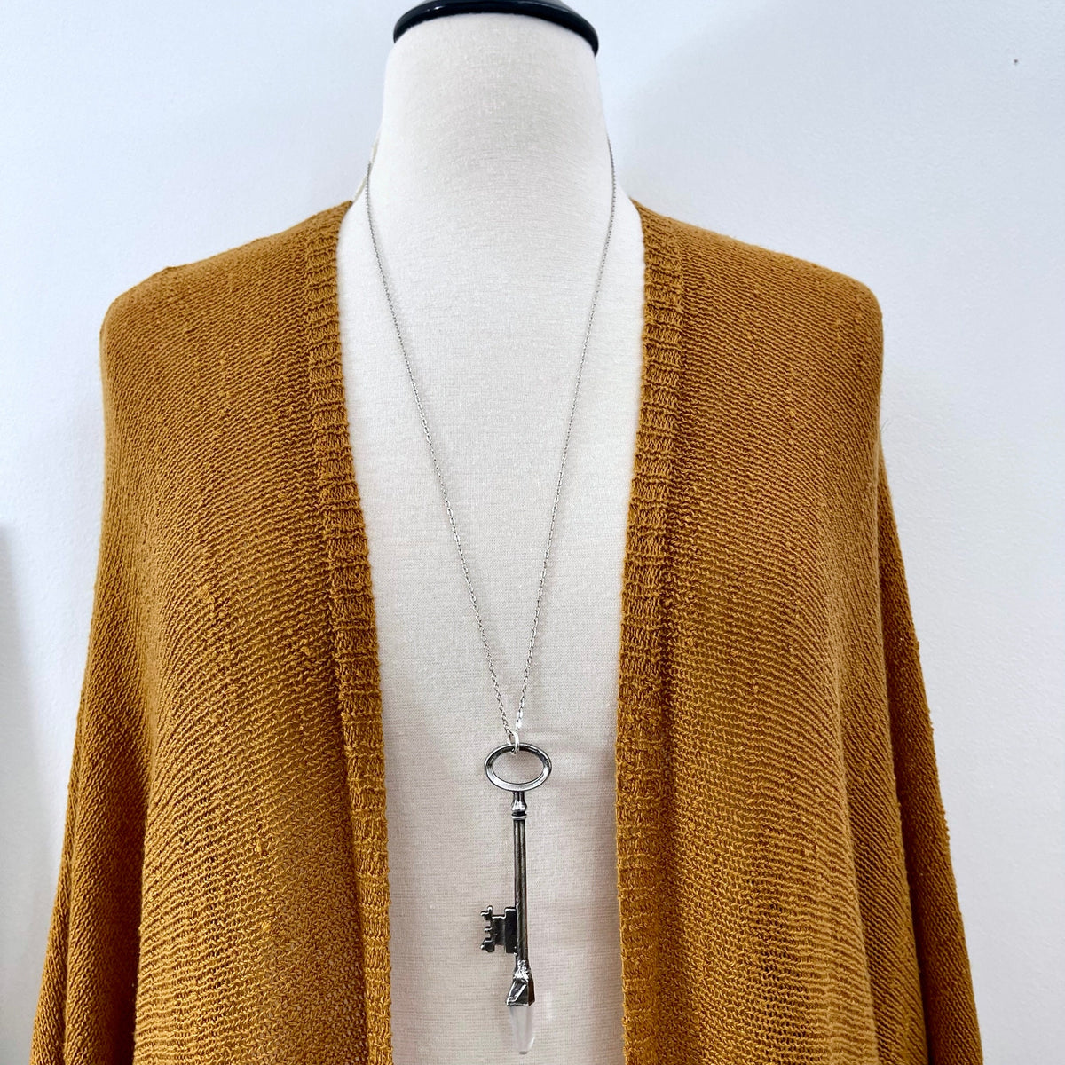 Raw clear quartz crystal pendant on vintage skeleton key necklace in silver, from FOXLARK's one-of-a-kind necklace collection.