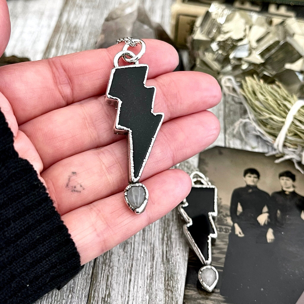 Black Onyx and Clear Quartz lightning bolt pendant necklace by FOXLARK, featuring crystal accents, Gothic jewelry style.