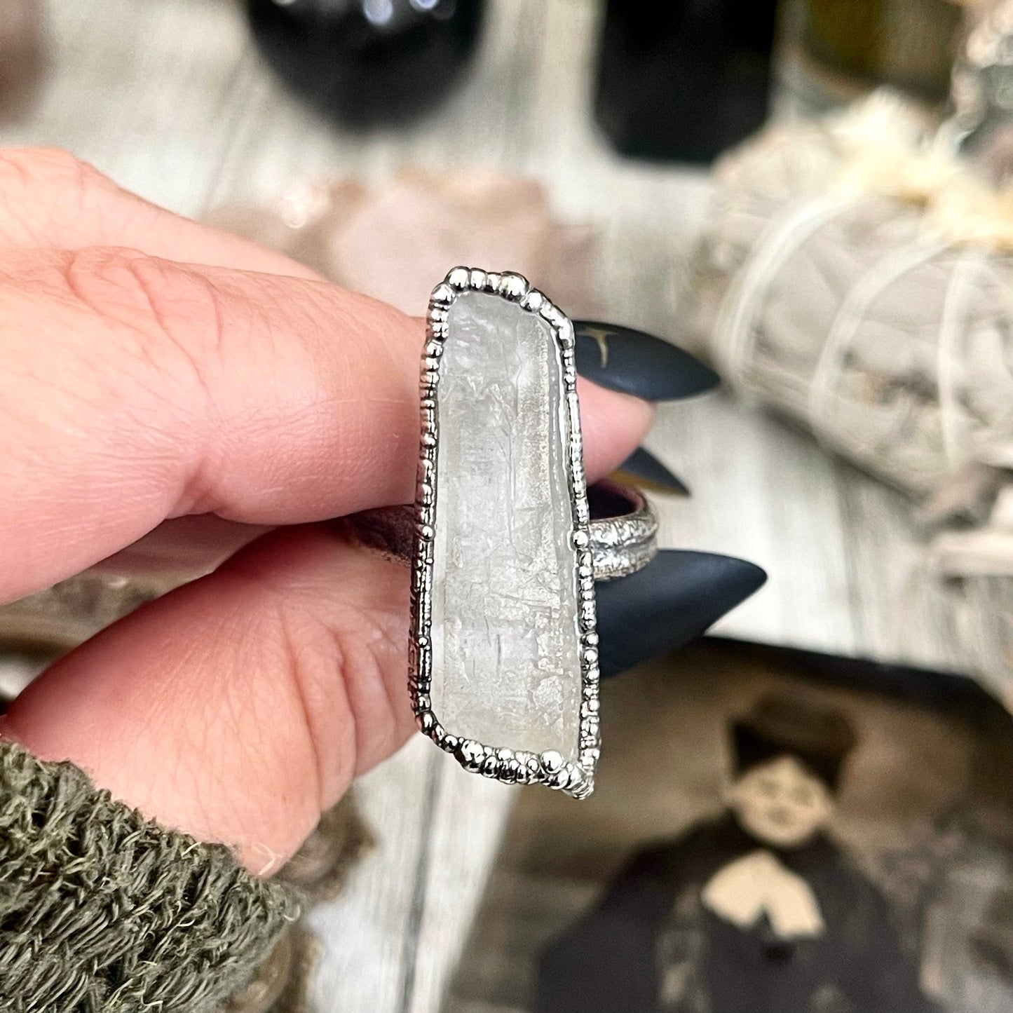 Raw clear quartz crystal point ring set by FOXLARK featuring fine silver bands in sizes 5 to 9, one of a kind jewelry collection.