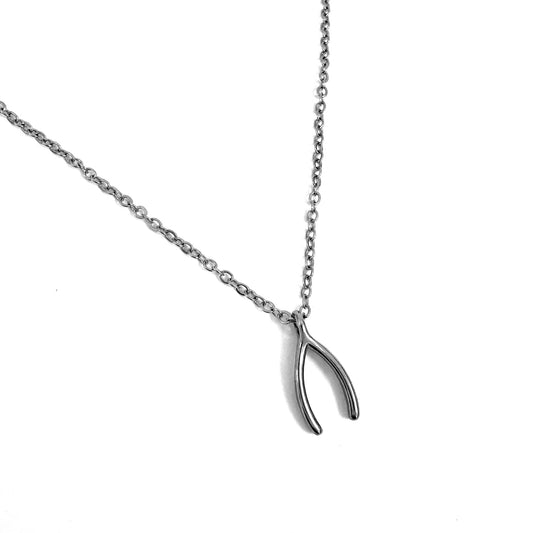FOXLARK wishbone charm pendant with "Wish Harder" and "Keep the Bone" inscriptions, jewelry charm on a chain.