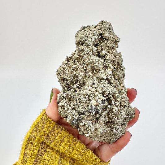 Self-standing pyrite crystal cluster from FoxlarkCrystals, featuring metallic gold pyrite formations on a natural mineral base.