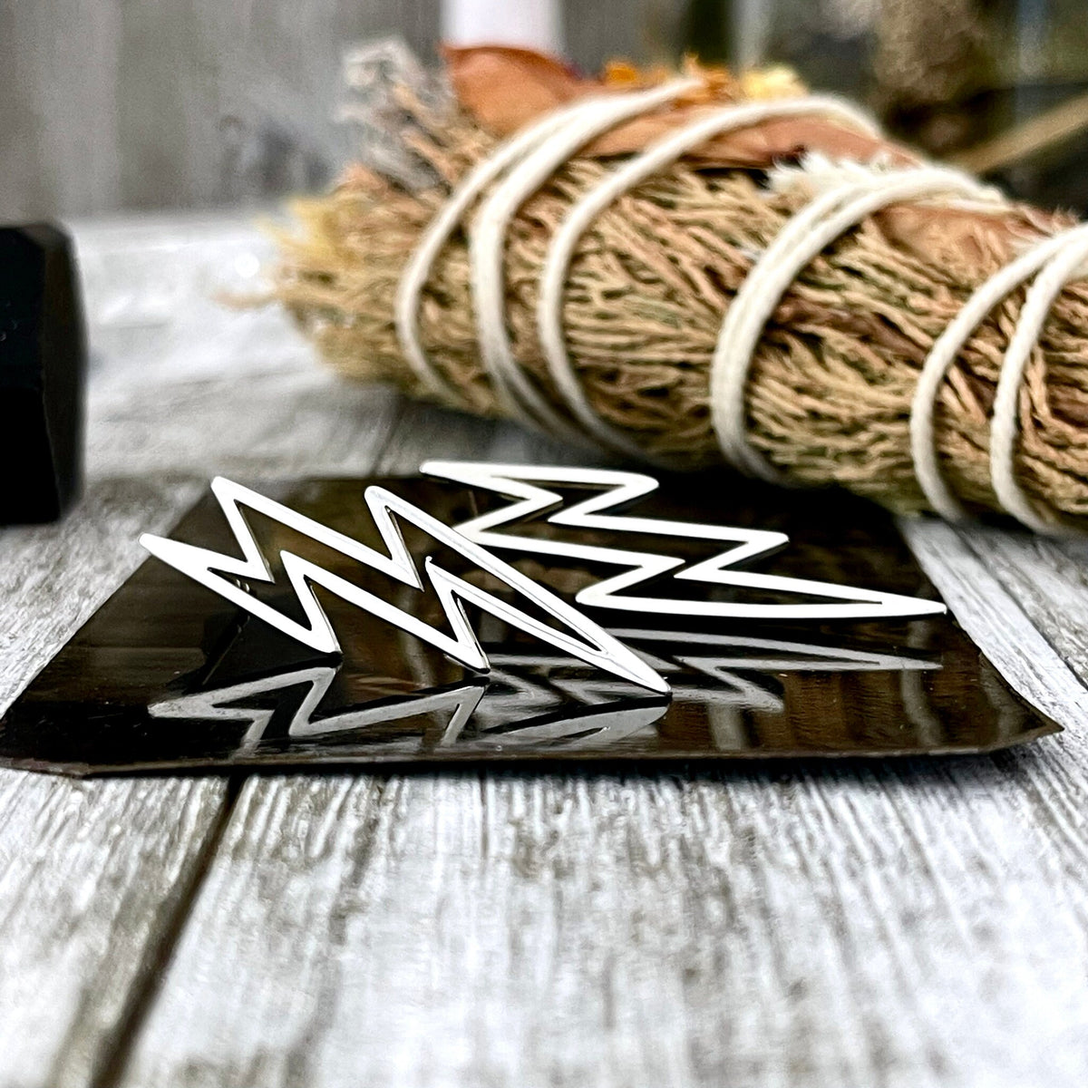 Sterling silver lightning bolt stud earrings set by FOXLARK featuring bold, minimalist lightning bolt designs for women.