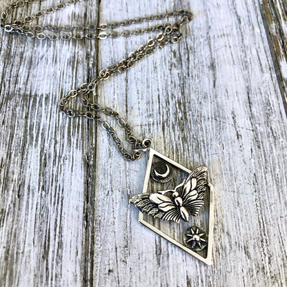 Tiny Talisman Collection - Sterling Silver Geometric Moth Necklace with Sun and Moon 32x21mm  /.