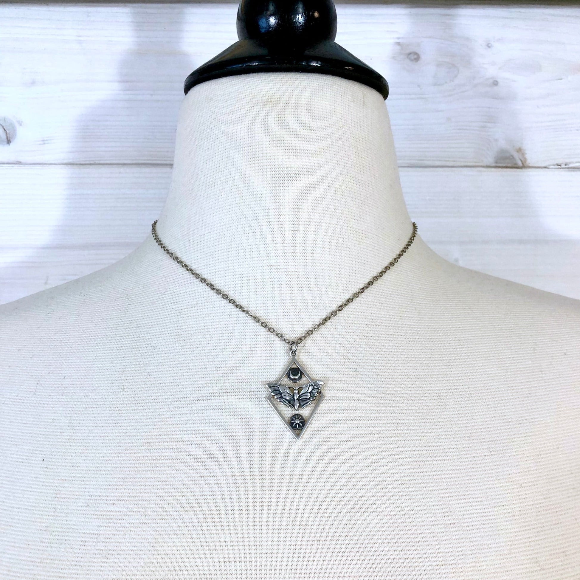 Tiny Talisman Collection - Sterling Silver Geometric Moth Necklace with Sun and Moon 32x21mm  /.